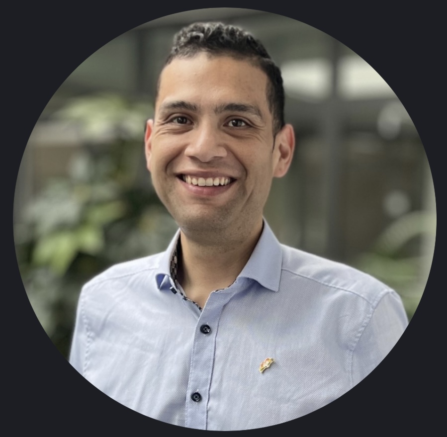 Joshua Castro smiling in a light blue shirt