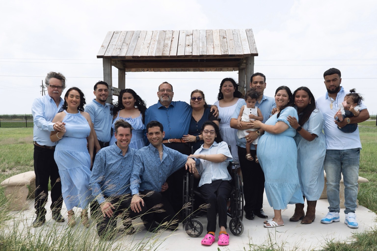 Joshua Castro with his family gathered outdoors